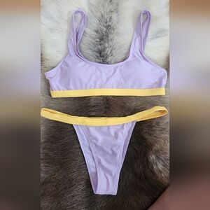 Two piece sporty bathing suit in light purple and yellow in size M